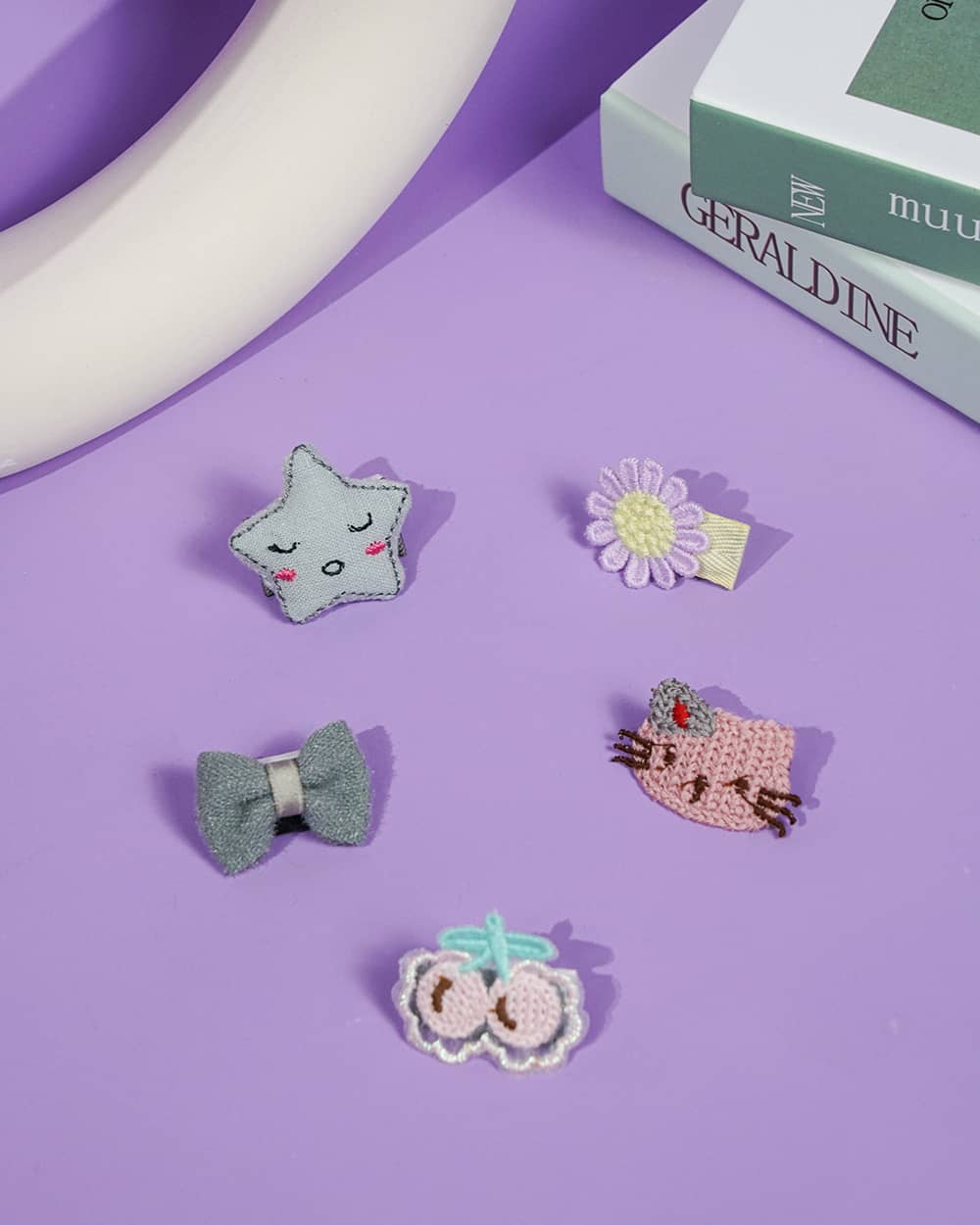 This set of Cute Cat and Floral Pet Hair Clips offers a practical and stylish solution for pet owners, featuring a variety of playful designs including a plush star, crocheted cat, velvet bow, and vibrant flower clips that attach securely without irritating the skin